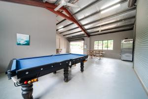 a large room with a pool table in it at Tranquility Retreat in Mission Beach