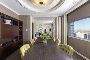 a dining room with a long table and chairs at Palace Hotel Omiya in Saitama +59 photos