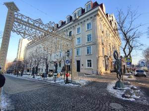 a building with a large metal structure in front of it at Smart Loft Studio Center Walking street in Chişinău +36 photos