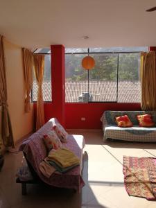 a bedroom with a bed and a large window at Large quiet apartment in condominium in Santa Eulalia