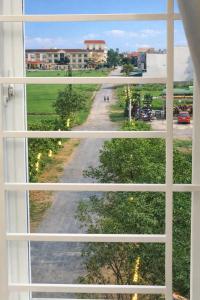 a window with a view of a road at Phương Phương 2 Hotel in Hà Tĩnh +32 photos