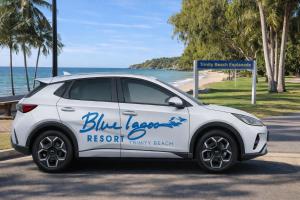 a white car parked next to the beach at Blue Lagoon Resort in Trinity Beach +88 photos