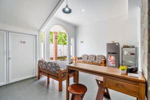a living room with a table and a couch at The Twenty Eight in Ungasan