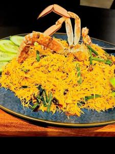 a plate of food with cheese on a table at Cool feel rest and cafe in Nuwara Eliya +35 photos