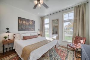 a bedroom with a bed and a tv and a window at 2 BR King Bed Hot Tub AC Near Jackson in Victor