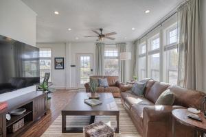 a living room with a couch and a table at 2 BR King Bed Hot Tub AC Near Jackson in Victor