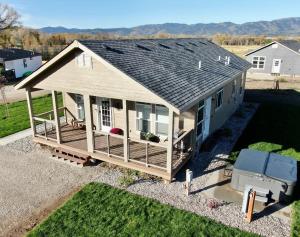 an overhead view of a house with a porch at 2 BR King Bed Hot Tub AC Near Jackson in Victor