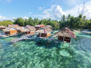 an aerial view of a resort in the water at Adefiro homestay in Waisai +91 photos