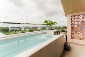 a swimming pool on the roof of a building at Palmera Hoi An Villa & Apartment in Hoi An