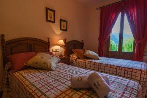 Säng eller sängar i ett rum på Casa Martin Ordesa
