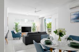 a living room with a couch and a table at Boulevard North Lakes in North Lakes