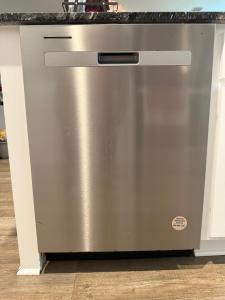a stainless steel dishwasher in a kitchen at Homely in Richmond