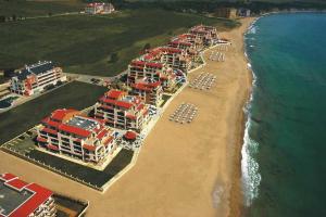 an aerial view of a beach with chairs and umbrellas at First Line Apartment at Obzor in Obzor