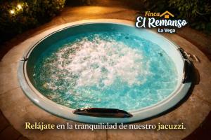 a hot tub with water in it at Finca El Remanso La Vega in La Vega