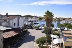 a view of a marina with boats in the water at Stars Palace - apartments and rooms in Jezera