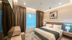 a bedroom with a bed and a large window at Royal Home in Abu Dhabi +193 photos
