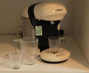 a blender and two glasses on a counter at Studio for 2 people in Bouloc