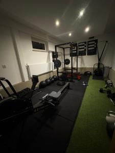 a room with a gym with weights and machines at Kapi-Spa Pokoje i Apartamenty in Kluszkowce