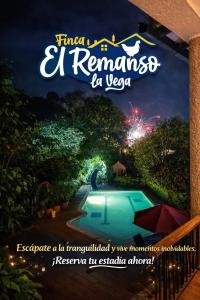a sign for a resort with a swimming pool at night at Finca El Remanso La Vega in La Vega