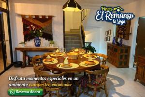 a dining room table with bowls and plates on it at Finca El Remanso La Vega in La Vega +95 photos