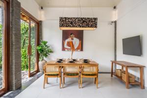 a dining room with a table and chairs at Mimosa - Private Pool Escape with Panoramic Views in Kerobokan +17 photos