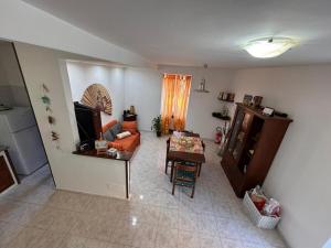 a living room with a couch and a table at DaLu' tourist accommodation in Vallerano +9 photos
