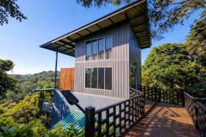 a small house with a fence around it at Sunray Hill in Ranong