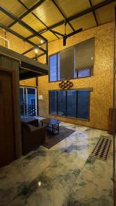 a living room with a table and some windows at Sunray Hill in Ranong +30 photos