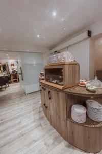 a kitchen with a counter with dishes on it at Gästehaus Achental in Berchtesgaden