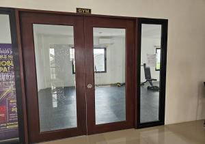 an office door with a sign on top of it at Ubec Vacation Home - Royal Oceancrest Mactan Cebu Condominium in Cebu City