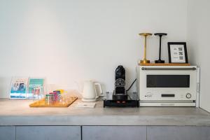 a microwave oven sitting on top of a counter at Amatera in Kami Amakusa