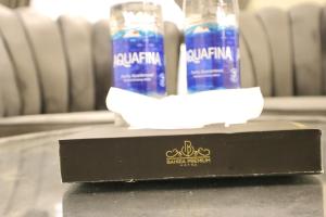 two bottles of water sitting on a table at Bahria Premium Hotel in Rawalpindi