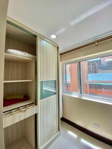an empty room with a window in a room at LG-15B City Center Staycation at Megatower 1 in Baguio