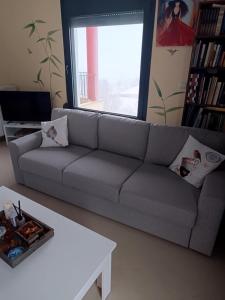 a living room with a couch and a coffee table at House with view in Levkopiyí