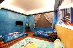 Postel nebo postele na pokoji v ubytování 3D Sunflower Embossed B&B
