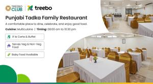 a conference room with white tables and yellow chairs at Treebo Executive Suites in Gandhinagar