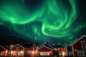 an image of the aurora borealis in the sky at Andøy Vest Rorbuer Reine in Reine