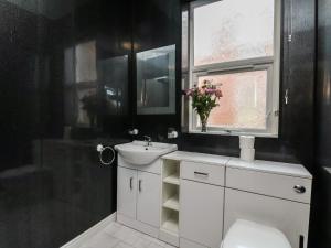 a bathroom with a sink and a toilet and a window at Bridlington Bay House in Bridlington +79 photos
