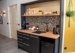 a kitchen with a sink and a counter at B and B Suite No.3 in Gorinchem +14 photos