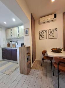 a kitchen and dining room with a table and chairs at Studio Apartment MD in Roč +35 photos