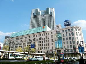 a large building in a city with tall buildings at 大阪難波ELLY-ten in Osaka