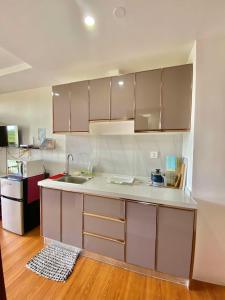 a kitchen with a sink and a counter top at 8F-08 Overlooking Condo at Megatower 3 in Baguio