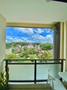 a balcony with a view of a city at 8F-08 Overlooking Condo at Megatower 3 in Baguio
