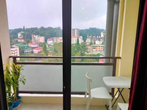 a balcony with a view of a city at 8F-08 Overlooking Condo at Megatower 3 in Baguio +1 photo