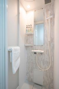 a bathroom with a shower and a mirror at 雪舞-YukiMai in Kutchan +62 photos