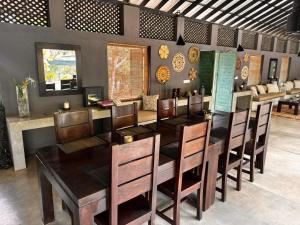 a dining room with a table and chairs at Yala Villa in Yala