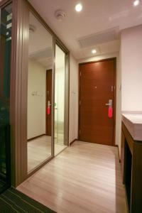 an office corridor with a door and a counter at Le Prabelle Hotel in Hong Kong