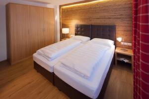Ein Bett oder Betten in einem Zimmer der Unterkunft Pfefferkorn's Ferienappartements