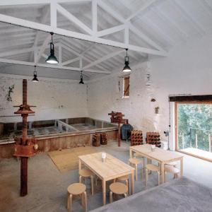 a large room with tables and a large tub at Quinta do Vale da Ermida, Private - Heated - Pool in Ermida