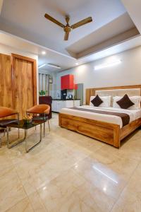 a bedroom with a large bed and a living room at The Palm Suites - Medicity in Gurgaon +75 photos